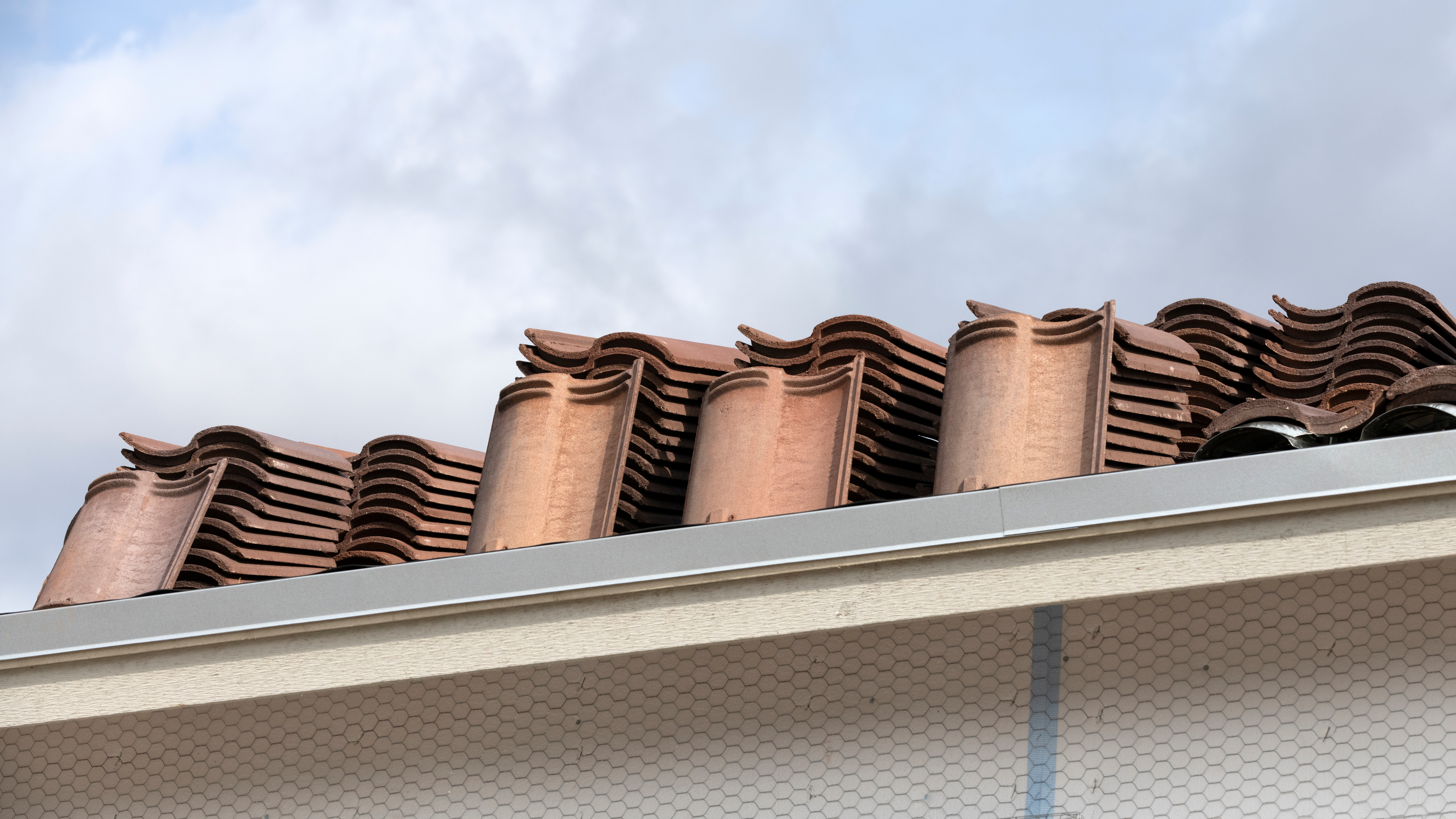 Top Questions About Residential Roofing 26 Roof Tiles Waiting To Be Installed